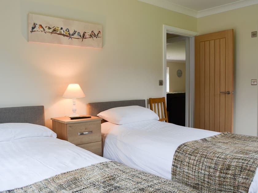 Pretty bedroom with twin single beds | Lucy’s at the Grange - Grange Country House Holiday Cottages, Loweswater, near Cockermouth