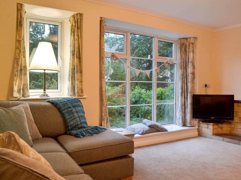 Spacious living room has wonderful views of the garden | The Mill Cottage, Heath, near Chesterfield