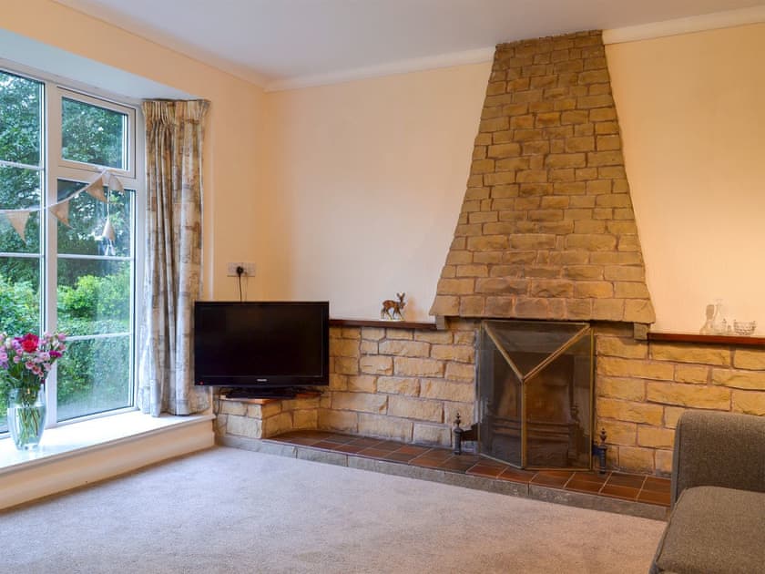 Comfortable living room with open fire | The Mill Cottage, Heath, near Chesterfield