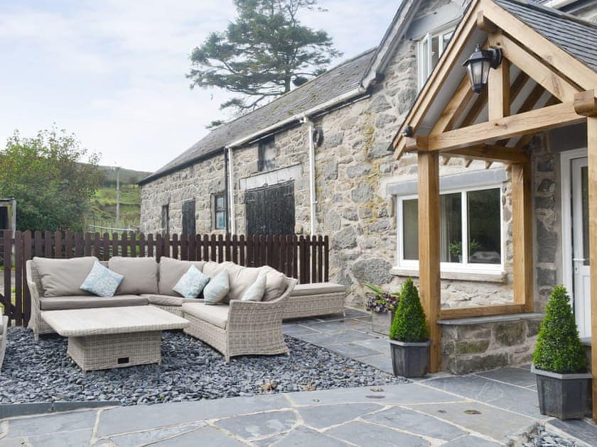 Outdoor furniture on the patio | Tyddyn Eli, Llangwm, near Corwen
