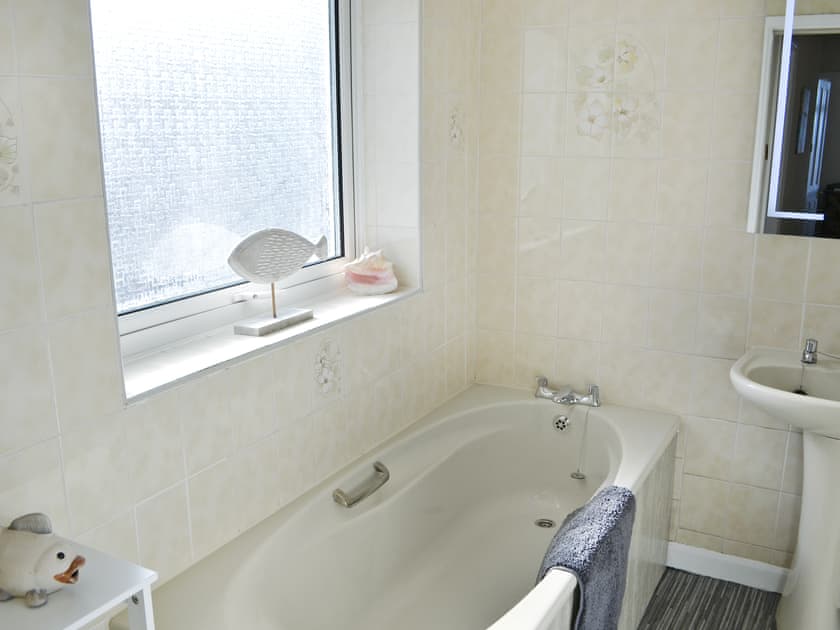Bathroom with bath and shower cubicle | Violet Cottage, Newbiggin-by-the-Sea