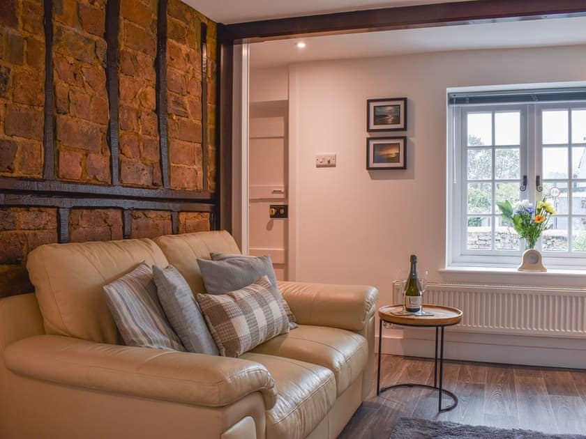 Characterful living room with exposed brickwork | Manor Cottage, Findon, near Worthing