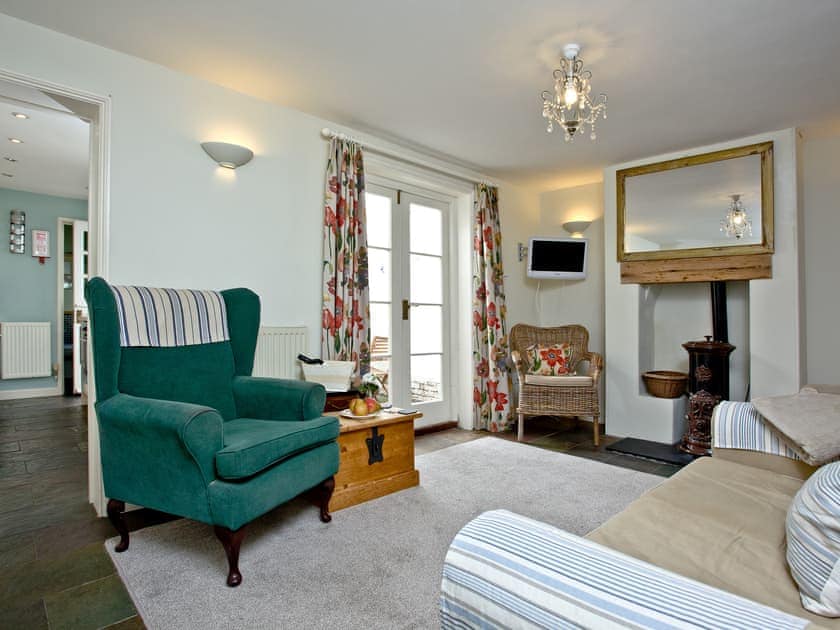 Comfortable flag-floored living room | Whitestones, Weymouth