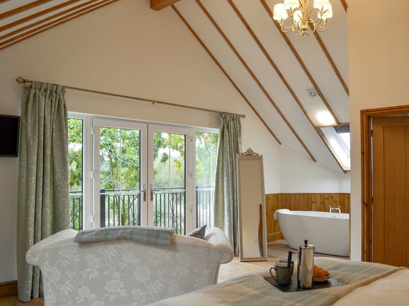 Beautiful, spacious, master bedroom | Lakeside Lodge, near Rhayader