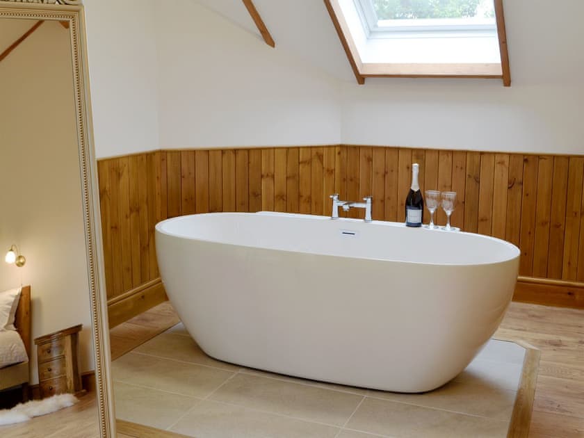 Free-standing bath within the master suite | Lakeside Lodge, near Rhayader