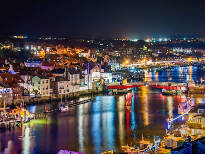 Harbour and centre of Whitby lit up at night | Harbourside House, Whitby