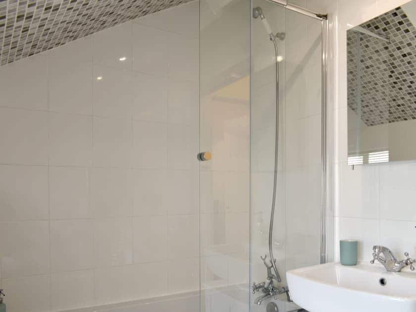 Family bathroom with shower over bath | Cenwulf Cottage, Winchcombe, near Cheltenham
