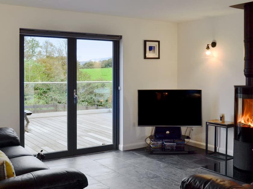 Comfortable living area with cosy wood burner | Thistlebank, Banton, near Kilsyth