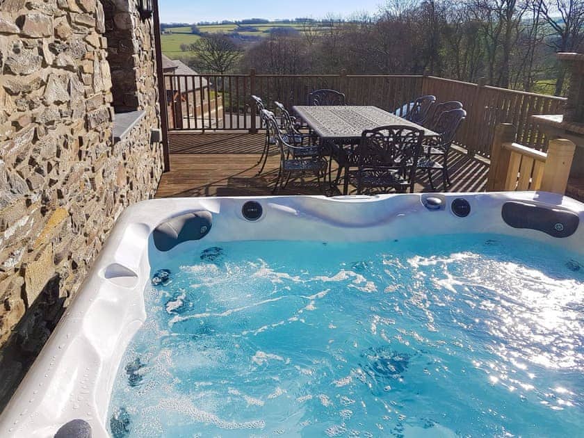Relaxing hot tub | The Mill - Ffynnonmeredydd Cottages, Mydroilyn, near Aberaeron