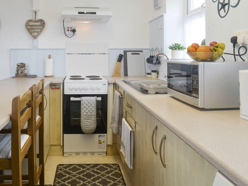 Well-equipped fitted kitchen | The Loft - Ty Copr, Pen-y-Sarn, near Amlwch