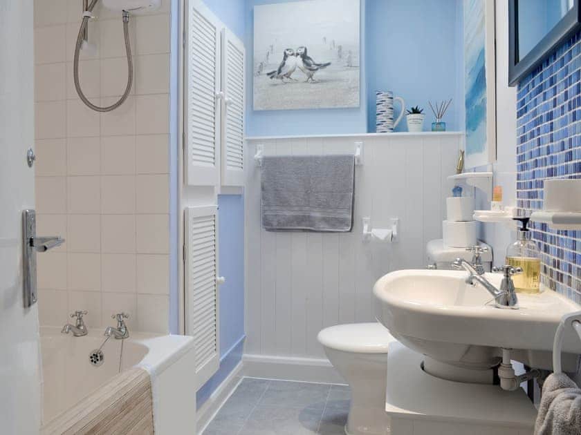 Bathroom with shower over bath | The Loft - Ty Copr, Pen-y-Sarn, near Amlwch