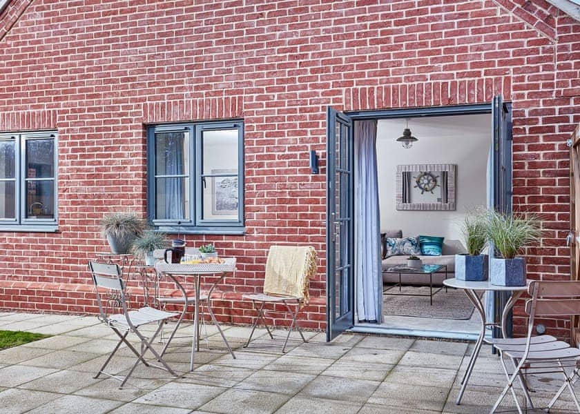 Paved patio with outdoor furniture | Seascape - Saltscape, Mundesley, near North Walsham