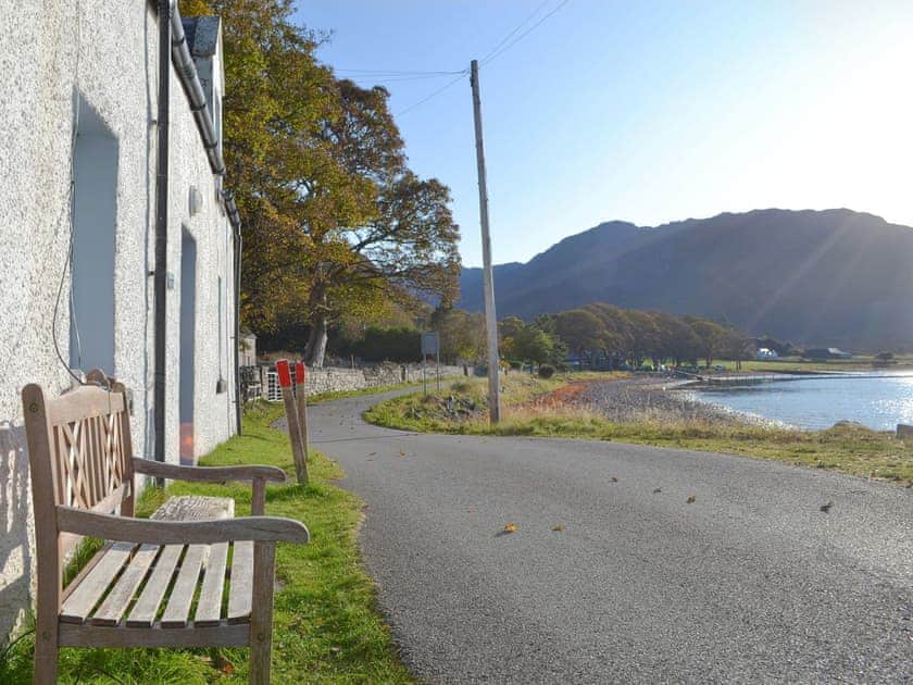 Outdoor seating upon which to appreciate the view | Shore Cottage, Arnisdale, near Glenelg