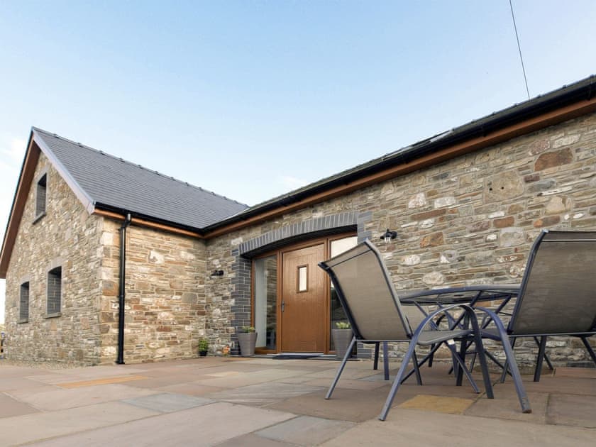Patio with seating area | Y Beudy Bach, Pontyberem, near Kidwelly