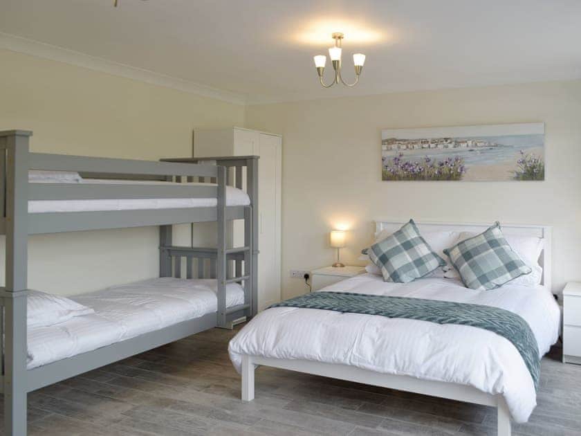 Ground floor bedroom with king and bunk beds | Green Acre, St Dogmaels, near Cardigan