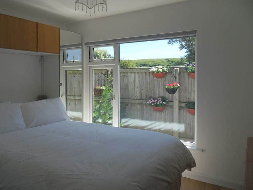 Comfortable double bedroom | Chalet One, Bridport