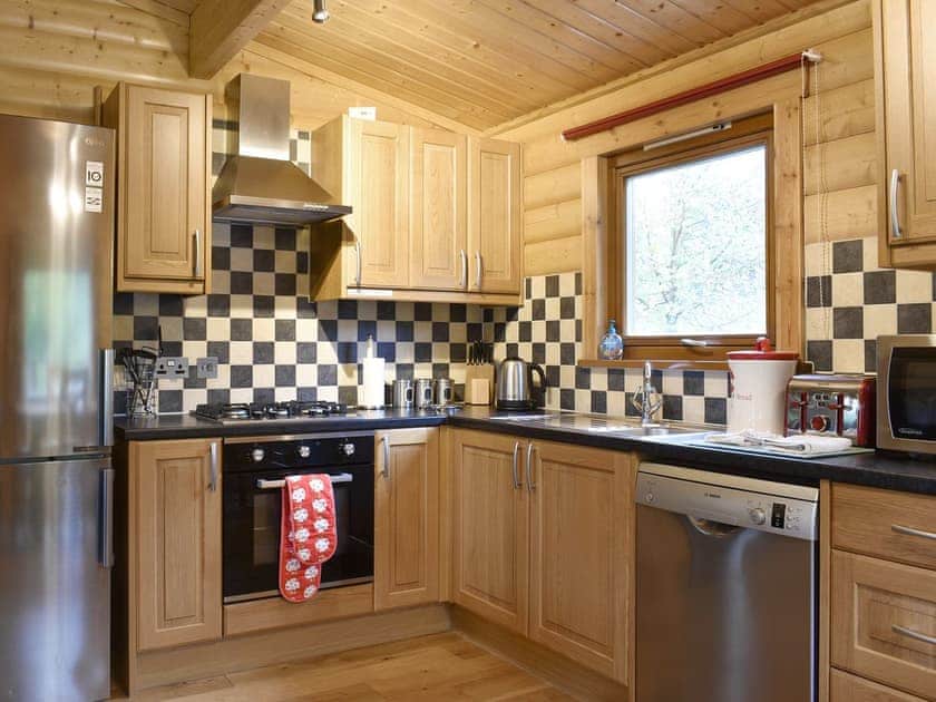 Fully equipped kitchen with dining area within the open-plan design | Alpine - Viaduct Fisheries, Somerton