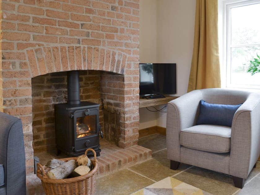 Welcoming living room with wood burner | Olivia - Ranby Cottage Farm, Ranby, near Retford