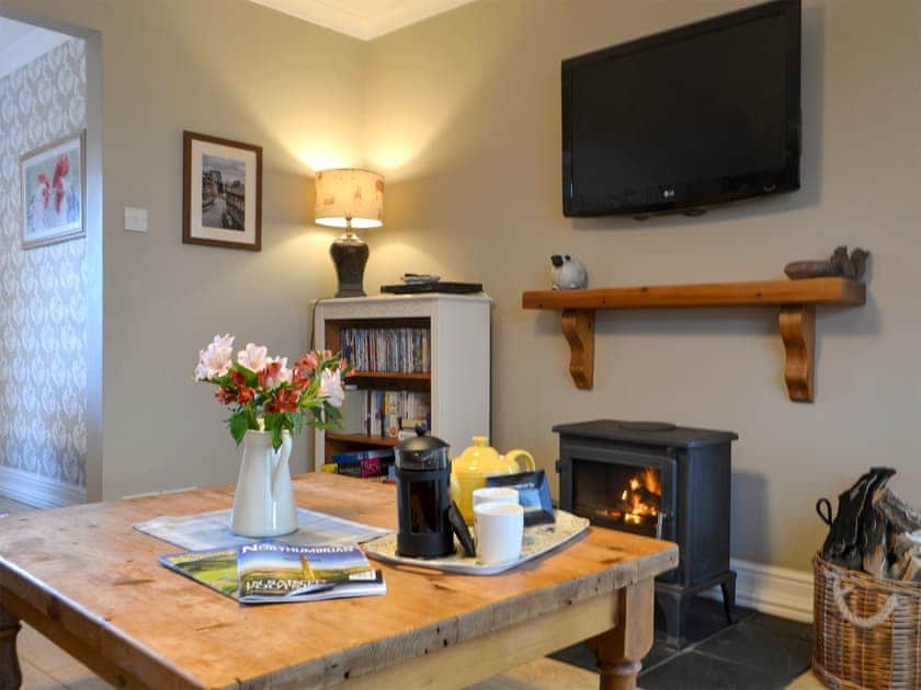 Cosy living area with wood burner | Westfield Farm Cottage, East Holywell, near Whitley Bay