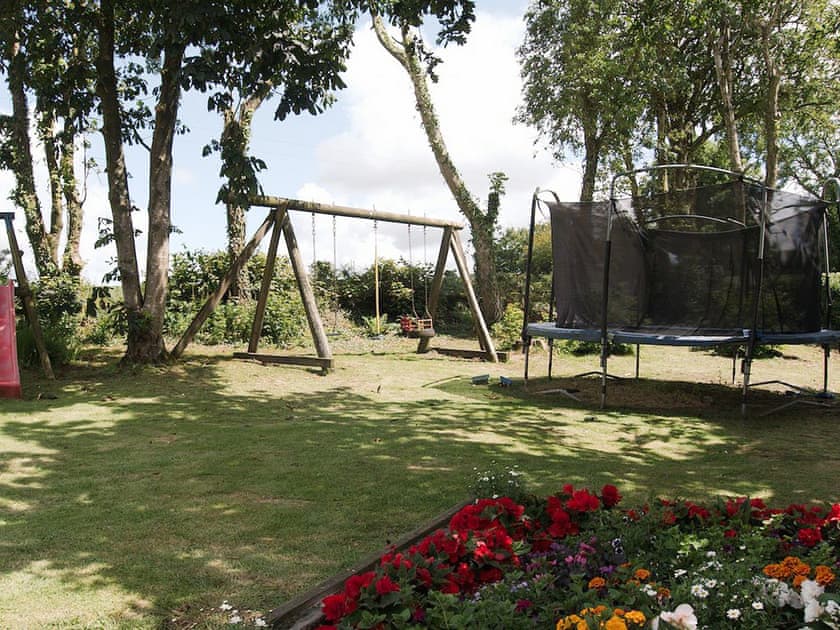 Communal children’s play area | The Farmhouse, The Carthouse, The Orchard - Morlogws Farm Holiday Cottages, Capel Iwan, near Newcastle Emlyn
