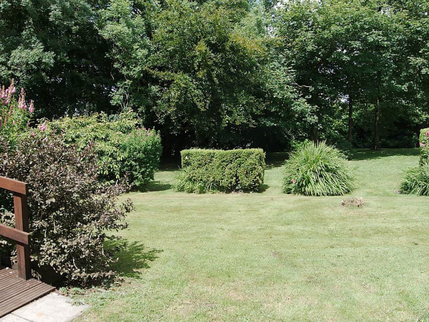 Well-maintained garden | The Orchard - Morlogws Farm Holiday Cottages, Capel Iwan, near Newcastle Emlyn