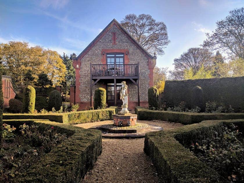 Set amidst beautifully manicured formal gardens | The Coach House, Tatterford Hall, near Fakenham