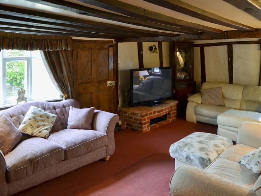 Beamed living room with comfortable sofas | Tattlepot Farmhouse, Pulham Market, near Diss