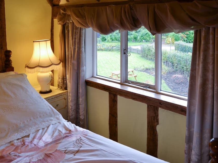 Lovely bedroom overlooking the garden | Tattlepot Farmhouse, Pulham Market, near Diss