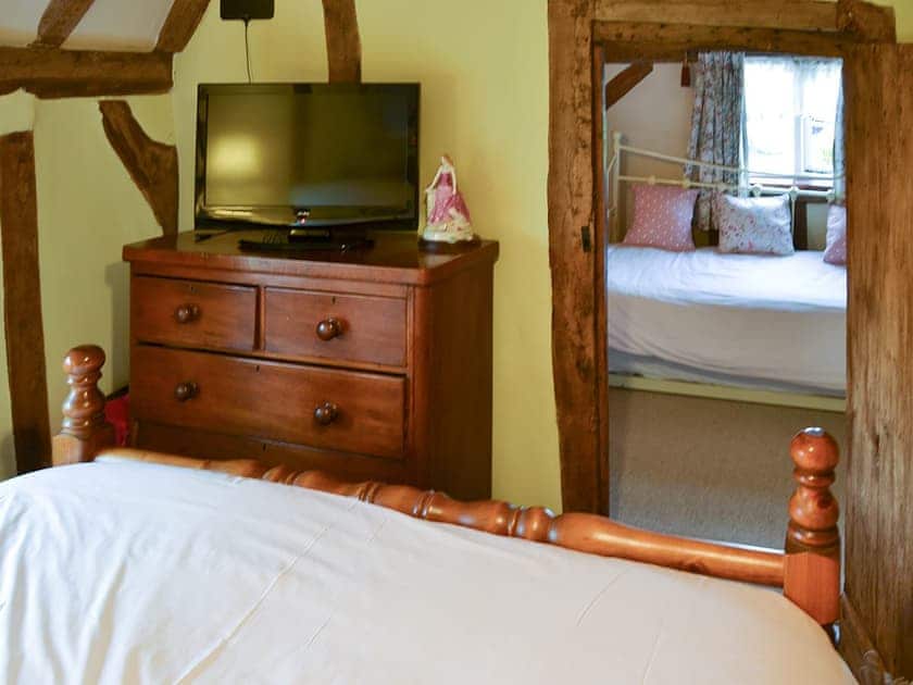 Bedroom with dressing area | Tattlepot Farmhouse, Pulham Market, near Diss