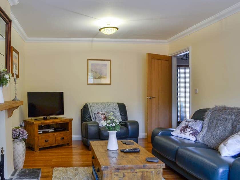 Lovely wood-floored living room | Ty Glyndwr, Lower Cwm-twrch, near Ystradgynlais