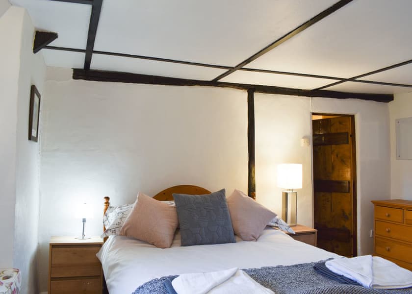 Bedroom with exposed woodwork | Yew Tree Cottage, Farnham, near Blandford Forum