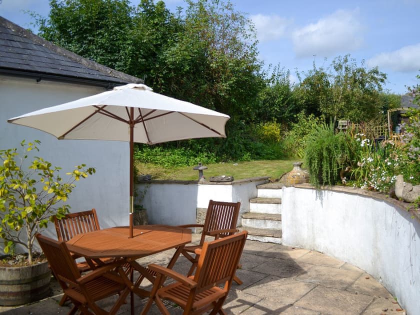 Patio with garden furniture | Yew Tree Cottage, Farnham, near Blandford Forum