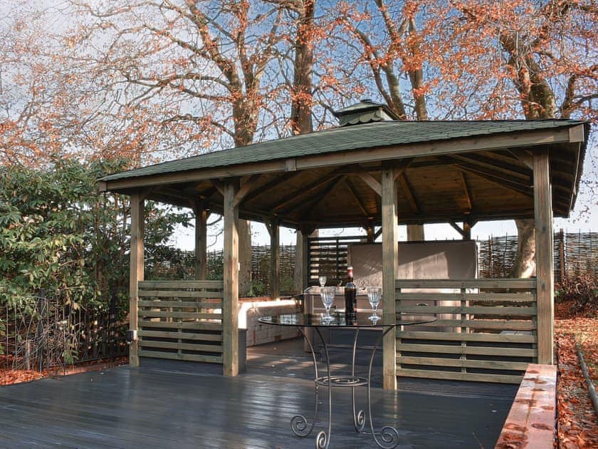 Outdoor space with hot tub | Sutton Lea Manor, Snettisham