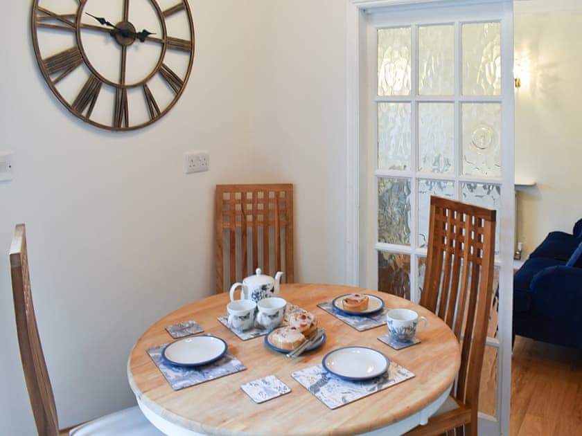 Compact dining area with double doors from the living room | The Cottage by the Sea - The Cottages by the Sea, Littlehampton, near Arundel