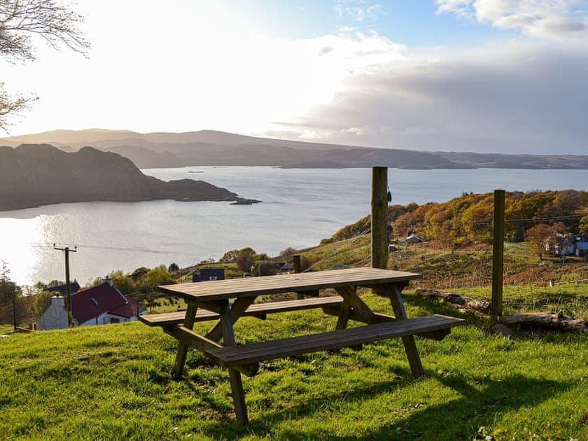 Outdoor seating area with wonderful views | Eleven Diabaig Cottage, Diabaig, near Torridon