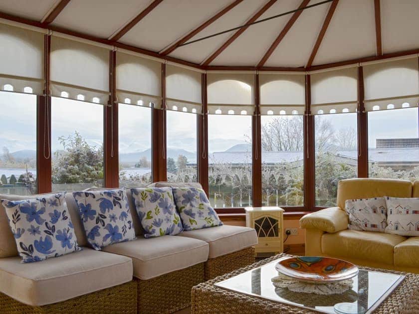 Well-furnished conservatory | Rowan Cottage, Aviemore