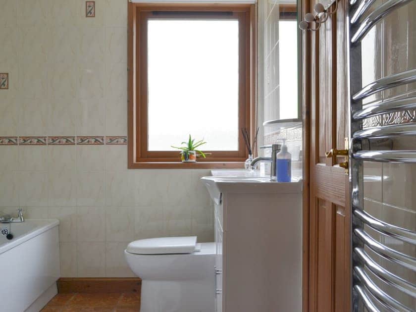 Family bathroom with bath and separate shower cubicle | Rowan Cottage, Aviemore