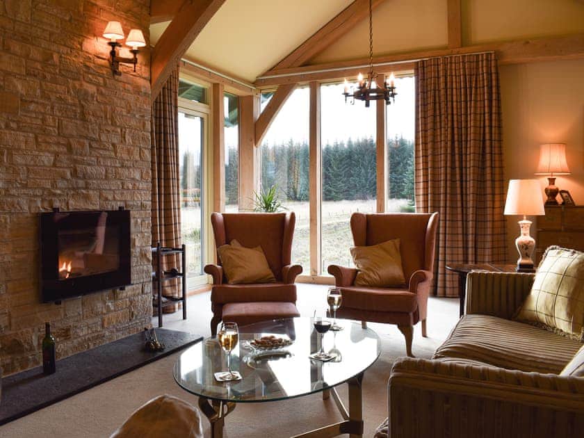 Cosy living room with wood burner | Mill of Burncrook, Glenlivet, Ballindalloch, Moray 