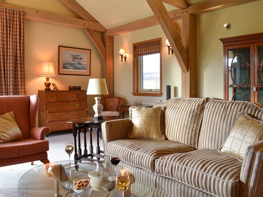 Cosy living room with wood burner | Mill of Burncrook, Glenlivet, Ballindalloch, Moray 