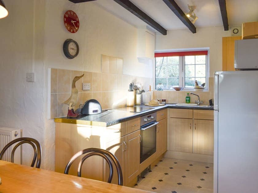 Fully equipped kitchen with dining area | Caro’s Cottage - Cartole Cottages, Pelynt, near Looe