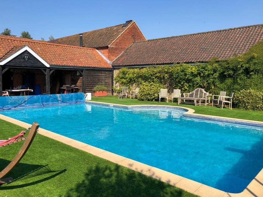 Shared outdoor heated swimming pool | Orchard House, Hempstead, near Holt