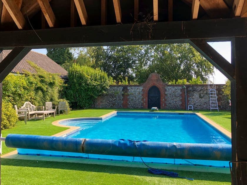 Shared outdoor heated swimming pool | Orchard House, Hempstead, near Holt