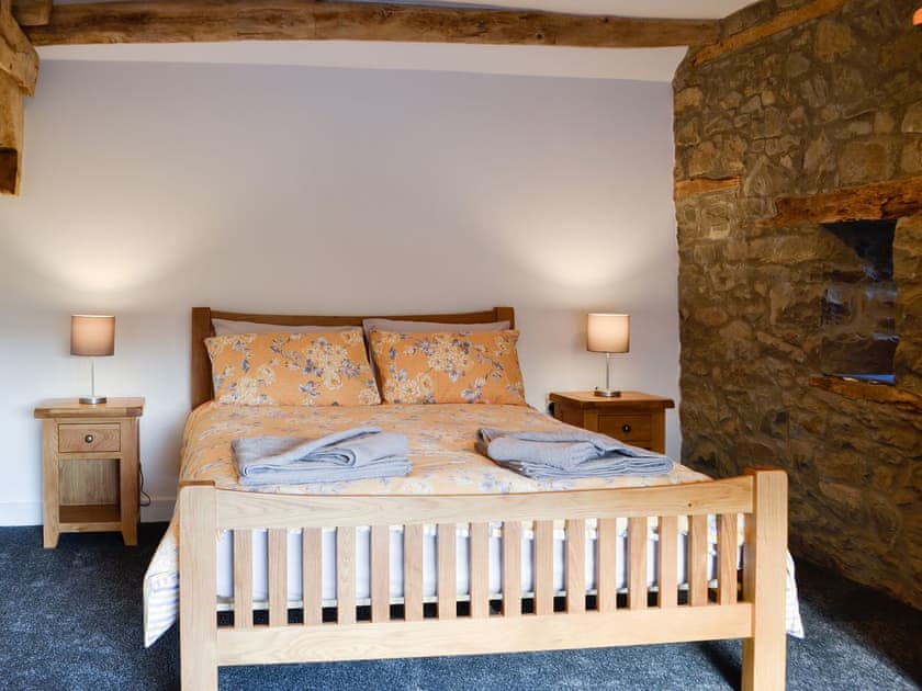 Lovely and romantic bedroom with exposed stone wall | Pistyll Gwyn, Llanwrthwl, near Rhayader