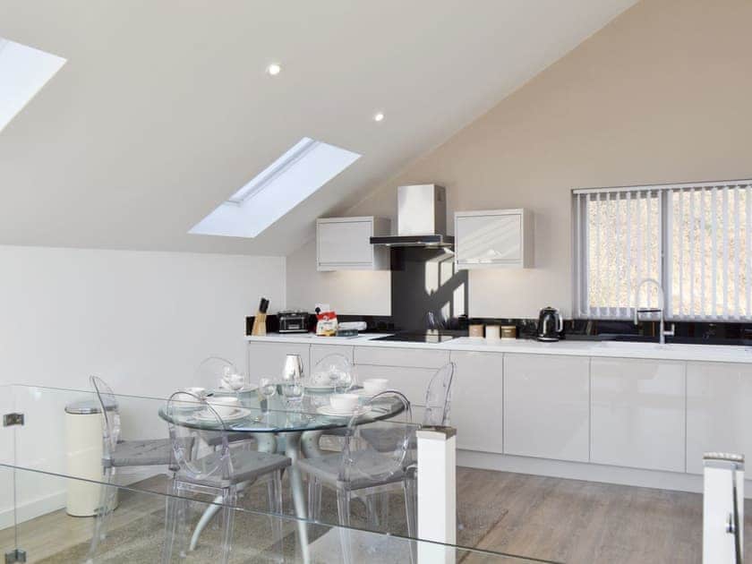 Fully equipped kitchen with dining area within the open-plan design | Waterside Lodge Sixteen - Ashgrove Country Park, Elland
