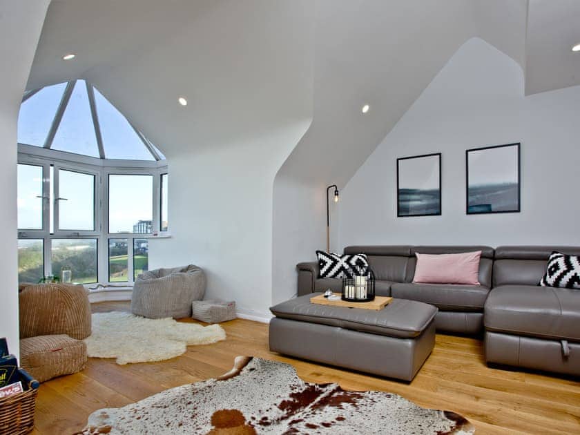 Comfortable seating within living area | Apartment 25, Newquay