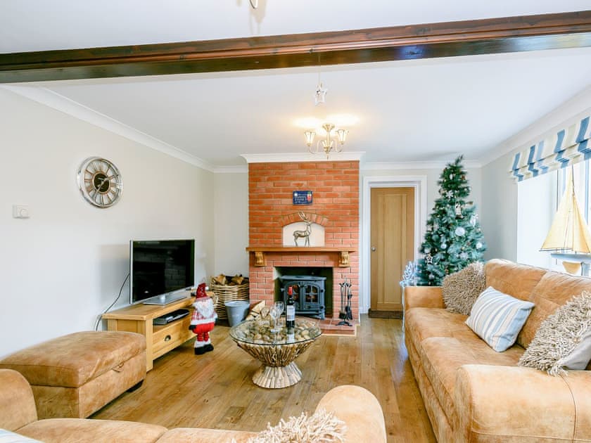 Beautifully presented living room with wood burner | Corner House, East Runton