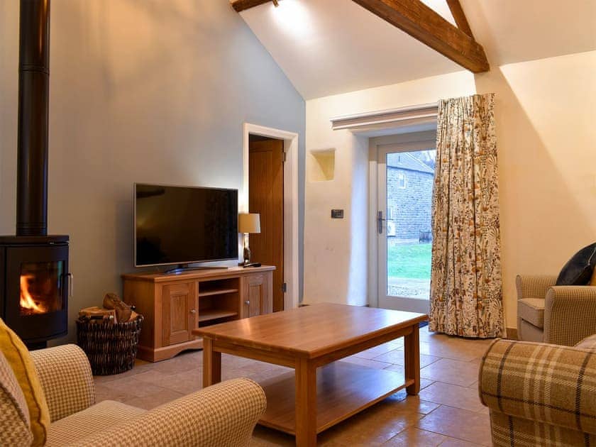 Welcoming living room with wood burner | Walnut Cottage, Harwood Dale, near Scarborough