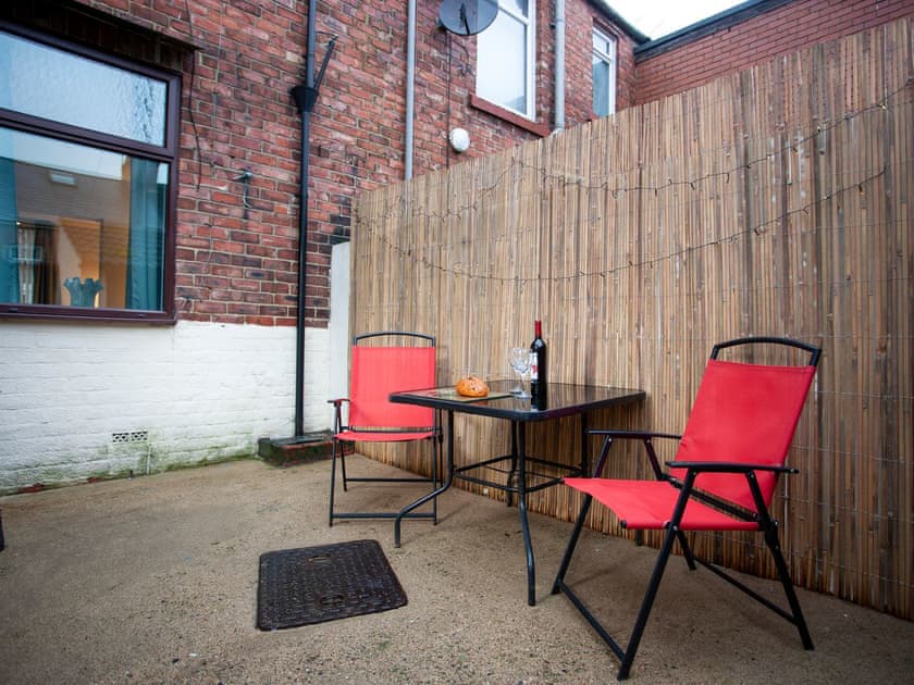 Enclosed yard with garden furniture | Freville Cottage, Shildon, near Bishop Auckland