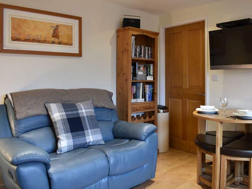 Comfortable living area with modest dining table and chairs | Stable Cottage, South Kilvington near Thirsk