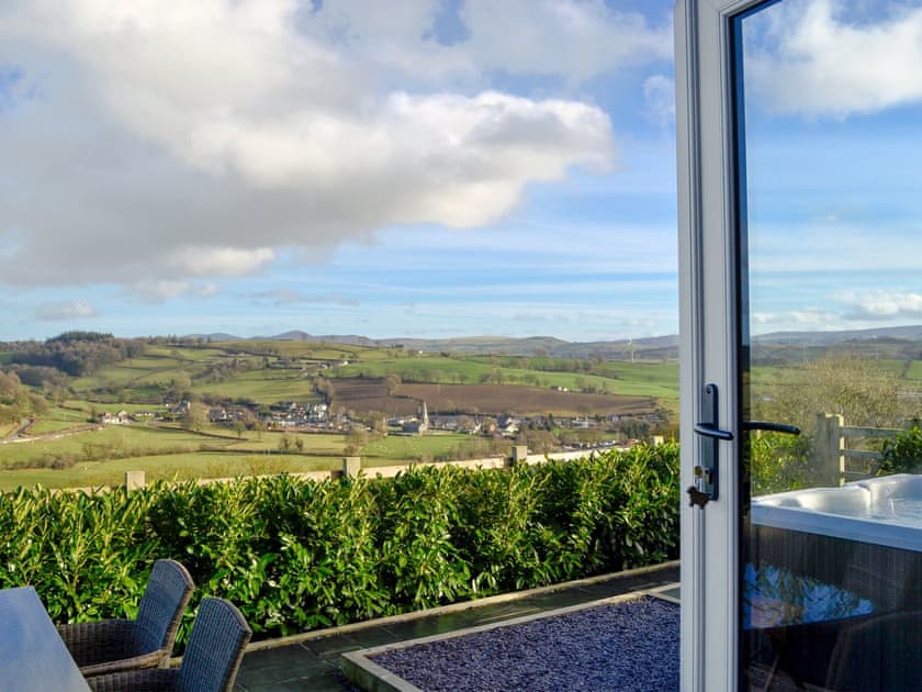 Paved patio with lovely views | The Barn, Gwyddelwern near Corwen